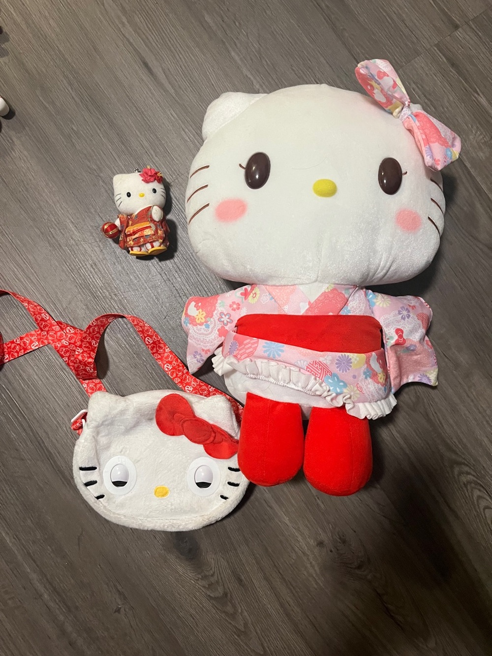Hello Kitty talking purse. 4" Hawaiian kitty key chain 17" big Hello Kitty plush